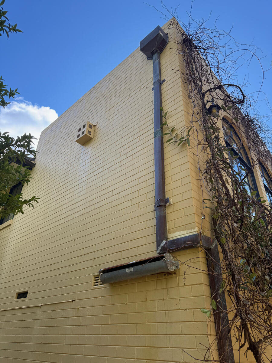 Cream rendered exterior wall — after soft wash