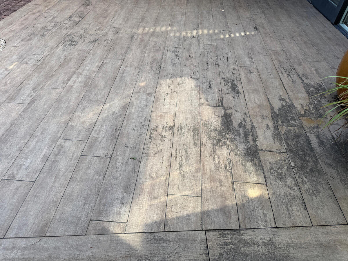 Timber-look tile pool deck — before pressure wash